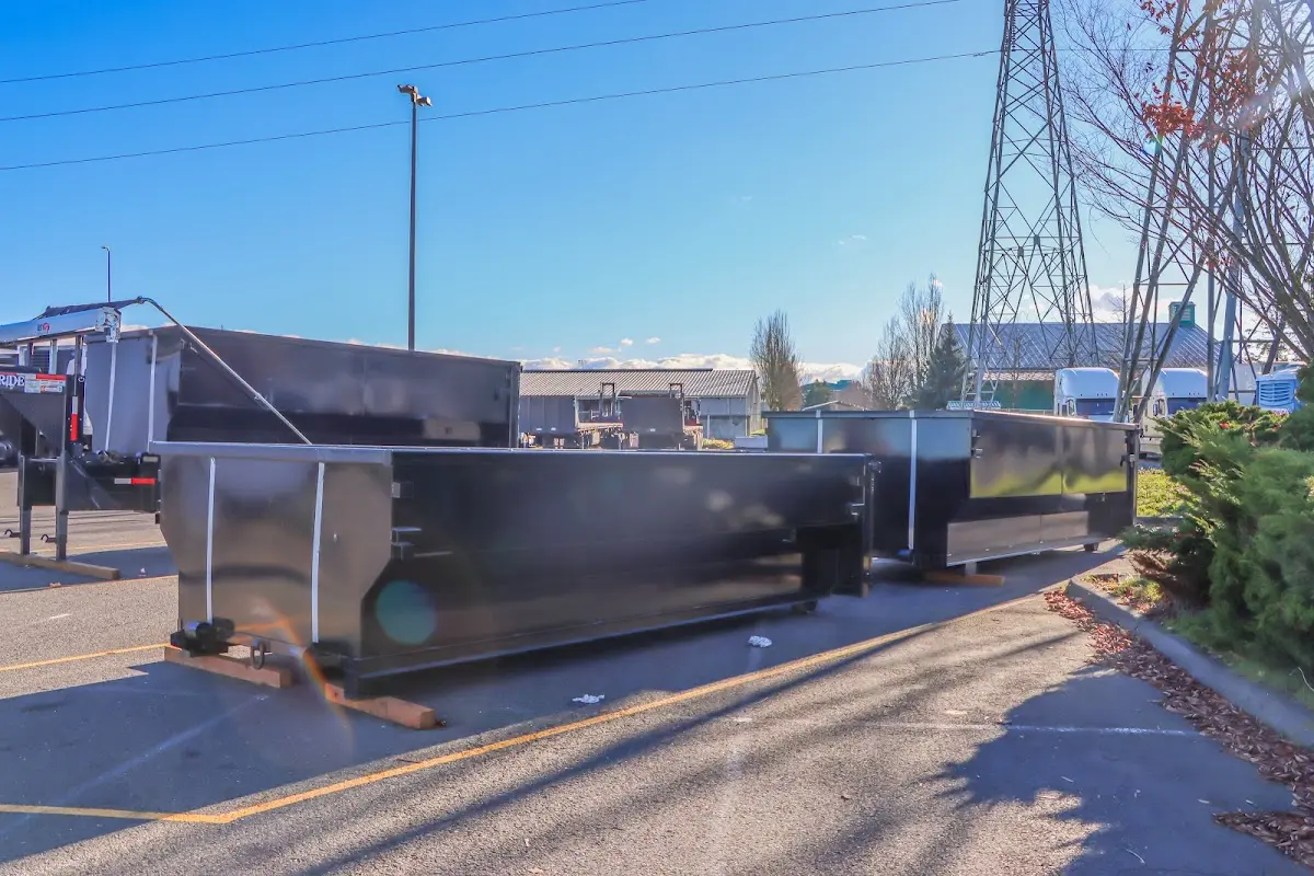 Roll-off dumpster ready for waste disposal at job site for 6 Yard Dumpster Rental in Linden